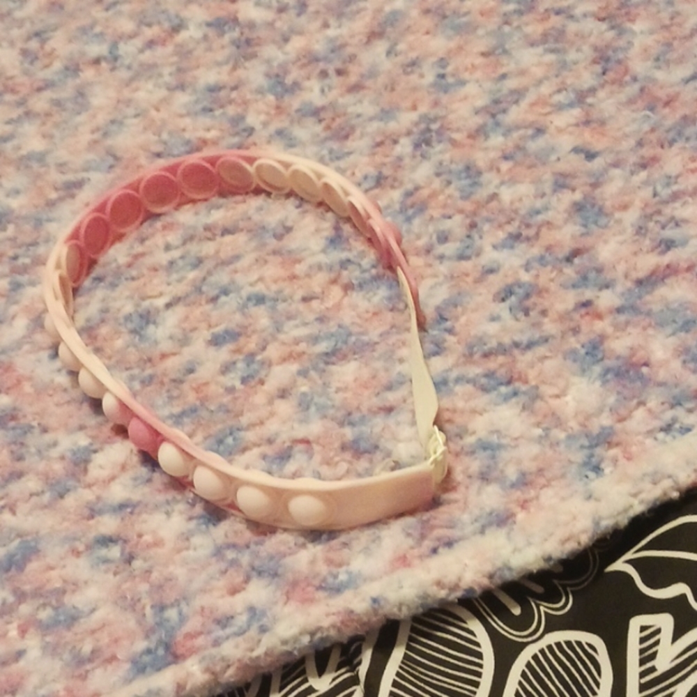 A pink and white popit neckless